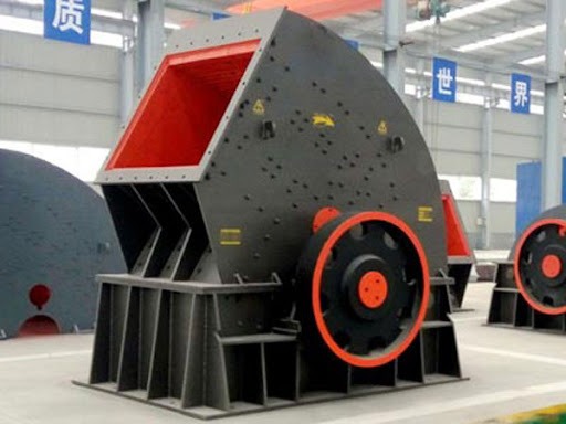 An external view of a hammer mill machine used for industrial material processing and pulverization.