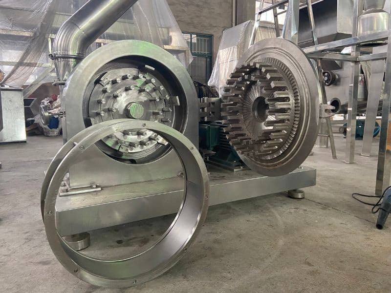 Interior view of a hammer mill, used for industrial material crushing and pulverization.